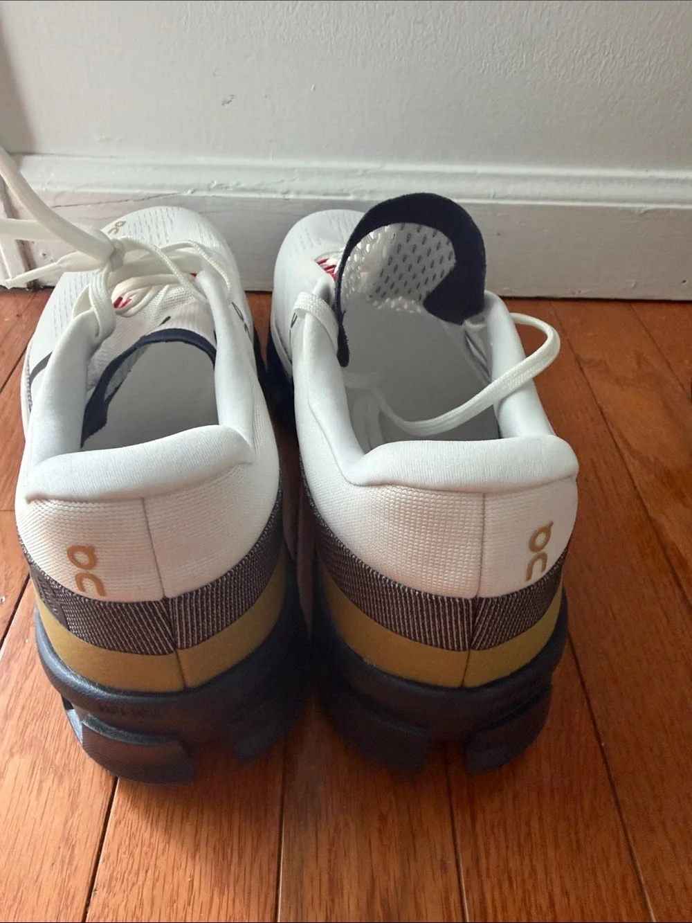 On Running White Athletic Running Shoes with Navy and Red Accents